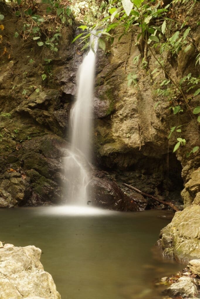  "Hidden waterfall and swimming hole near Puerto Jimenez on the road to Matapalo Osa Peninsula"